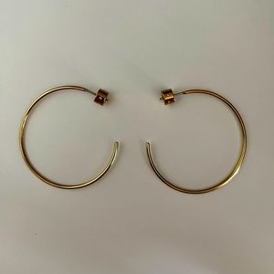 Mid-size gold plated hoop earrings by Michael Kors